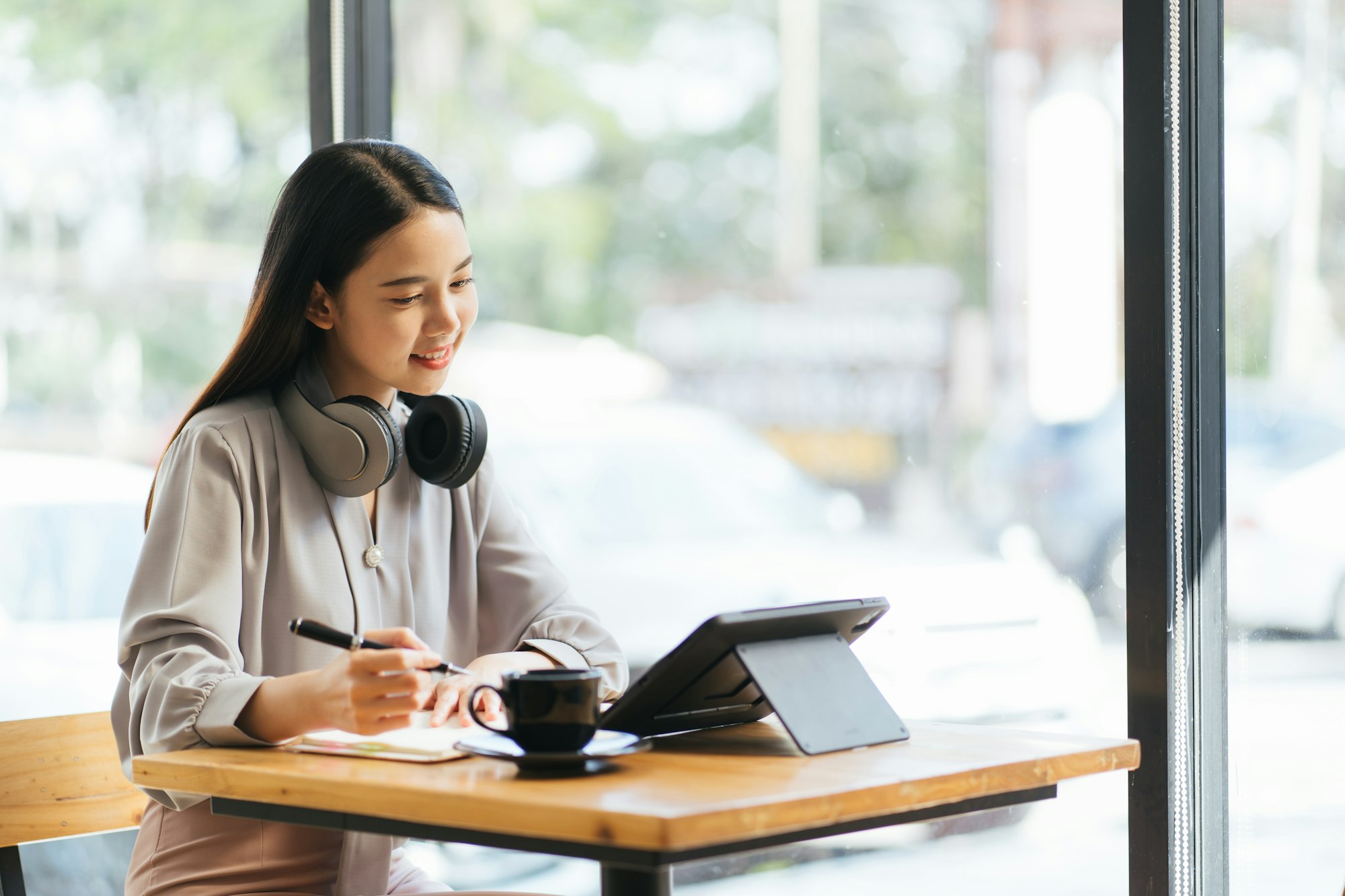 Freelance business women using tablet working call video conference with customer in workplace